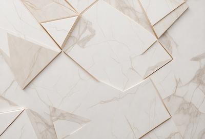The primary subject of the image is a white marble wall with a pattern of triangles. The setting is a room with a white marble floor. The visual style is a close-up of the marble wall, showcasing the intricate pattern of the triangles. The colors and mood of the image are predominantly white, giving it a clean and elegant appearance.