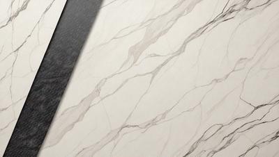 The primary subject of the image is a marble tile, which is the main object, scene, or focus of the image. The setting or background of the image is a wall, and the visual style is a photo. The colors and mood of the image are predominantly white, giving it a clean and elegant appearance.