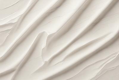 The image features a white, textured surface that resembles a piece of art or a sculpture. The primary subject is the white surface, which is the main focus of the image. The setting is a white background, which provides a clean and minimalistic environment for the artwork. The visual style is a combination of digital art and illustration, as the surface appears to be digitally created or manipulated. The colors and mood of the image are predominantly white, giving it a clean, minimalistic, and artistic