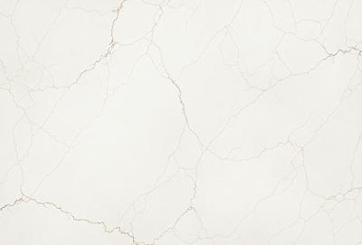 The primary subject of the image is a white marble wall with a rough texture. The setting is a room with a white marble floor. The visual style is a close-up of the marble wall, showcasing its unique texture. The colors and mood of the image are predominantly white, giving it a clean and elegant appearance.