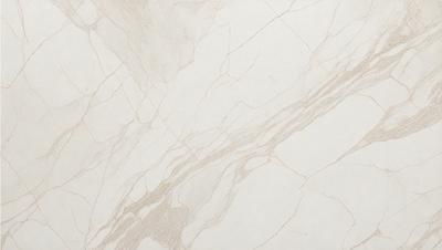 The primary subject of the image is a marble tile wall. The setting is a room with a white marble tile floor. The visual style is a close-up of the marble tile wall, showcasing its texture and pattern. The colors and mood of the image are predominantly white, giving it a clean and elegant appearance.
