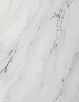 The primary subject of the image is a marble wall with a white and grey color scheme. The setting is a room with a white marble floor. The visual style is a close-up of the marble wall, showcasing its texture and details. The colors and mood of the image are predominantly white and grey, giving it a clean and elegant appearance.