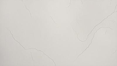The primary subject of the image is a white wall with a cracked and peeling texture. The setting is a room with a white background. The visual style is a close-up of the wall, showcasing the cracked surface. The colors and mood of the image are predominantly white, giving it a clean and minimalist appearance.