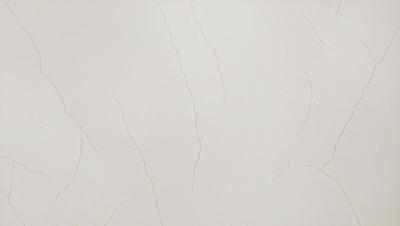 The primary subject of the image is a white wall with a cracked and peeling texture. The setting is a room with a white background. The visual style is a close-up of the wall, showcasing the cracked texture. The colors and mood of the image are predominantly white, giving it a clean and minimalist appearance.