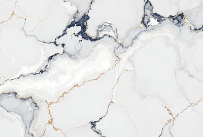 The primary subject of the image is a marble surface with a gold and white color scheme. The setting is a white marble countertop, and the visual style is a close-up of the marble surface. The colors and mood of the image are elegant and sophisticated, with the gold and white tones creating a luxurious and refined atmosphere.