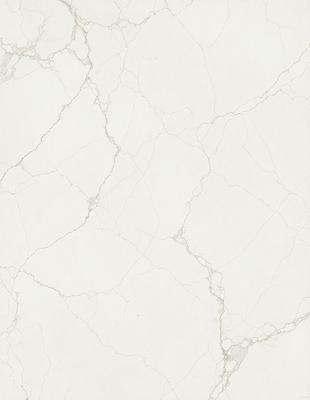 The image features a white marble wall with a pattern of holes and grooves. The wall appears to be a part of a building, possibly a bathroom or a kitchen. The marble surface gives the room a sophisticated and elegant appearance.