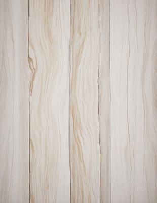 The primary subject of the image is a wooden wall with a wooden texture. The setting is a room with a wooden floor. The visual style is a close-up of the wooden wall, showcasing its texture and details. The colors and mood of the image are predominantly neutral, with a focus on the natural wood tones.