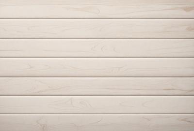 The image features a wooden wall with a smooth texture. The wall is made of wood planks, and it appears to be a part of a building. The wooden wall is the primary subject of the image, and it is set against a backdrop of a white wall. The visual style of the image is a close-up of the wooden wall, showcasing its texture and details. The colors and mood of the image are predominantly neutral, with the wooden wall being the main focus.
