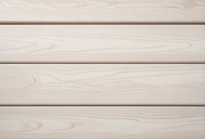 The primary subject of the image is a wooden wall. The setting is a white wall with wooden planks, giving it a clean and minimalist appearance. The visual style is a close-up of the wooden wall, showcasing its texture and details. The colors and mood of the image are predominantly white, creating a calm and serene atmosphere.