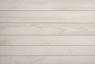 The primary subject of the image is a wooden wall with a patterned texture. The setting is a room with a white color scheme. The visual style is a close-up of the wooden wall, showcasing its unique texture. The colors and mood of the image are predominantly white, giving it a clean and minimalist appearance.