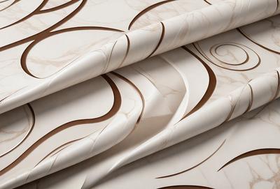 The primary subject of the image is a roll of marble paper, which is a decorative paper with a marble-like texture. The paper is displayed on a table, and it appears to be a patterned paper with a brown and white color scheme. The setting is indoors, with the paper being the main focus of the scene. The visual style of the image is a close-up of the marble paper, showcasing its unique texture and design. The colors and mood of the image are warm and inviting