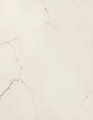 The image features a white marble wall with a cracked texture. The wall appears to be a part of a building, and the marble surface has a slightly rough texture. The cracked pattern adds a unique and interesting visual element to the wall.