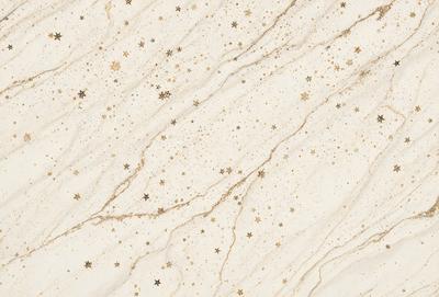 The primary subject of the image is a marble wall with a pattern of stars on it. The setting is a room with a white marble surface. The visual style is a close-up of the marble wall, showcasing the intricate pattern of stars. The colors and mood of the image are predominantly white, giving it a clean and elegant appearance.