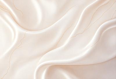 The primary subject of the image is a white sheet of fabric, which is the main object, scene, or focus of the image. The setting or background is a white sheet of fabric, and the visual style is a photo. The colors and mood of the image are predominantly white, giving it a clean and simple appearance.