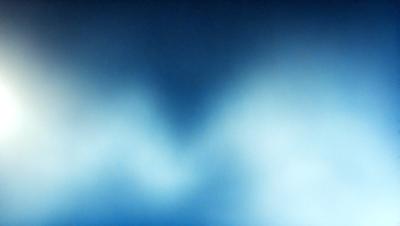 The primary subject of the image is a blue sky with clouds. The setting is a cloudy sky, and the visual style is a photo. The dominant colors are blue and white, creating a calm and serene atmosphere.