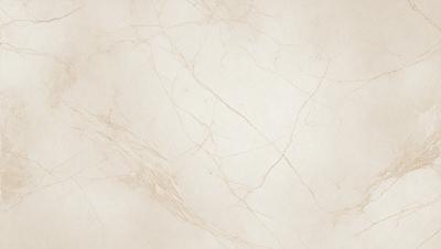 The primary subject of the image is a white marble wall with a pattern of cracks and crevices. The setting is a room with a white marble floor, which complements the wall. The visual style is a close-up of the marble wall, showcasing its unique texture and pattern. The colors and mood of the image are predominantly white, giving it a clean and elegant appearance.