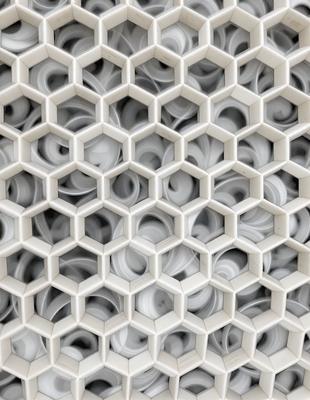 The primary subject of the image is a white, hexagonal pattern. The setting is a white background, and the visual style appears to be a pattern or texture. The dominant colors are white, and the overall atmosphere is clean and minimalistic.