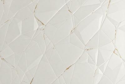 The primary subject of the image is a white tile wall with a pattern of triangles. The setting is a room with a white tile wall, and the visual style is a close-up of the wall. The dominant colors are white and gold, creating a clean and elegant atmosphere.