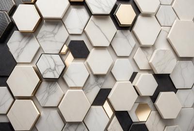 The primary subject of the image is a marble wall with a pattern of hexagons. The setting is a room with a white marble wall, and the visual style is a close-up of the wall. The dominant colors are white and black, creating a clean and modern atmosphere.