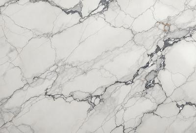 The image features a white marble wall with a pattern of holes and grooves. The wall appears to be a part of a building, possibly a bathroom or a kitchen. The marble surface gives the wall a luxurious and elegant appearance. The overall atmosphere of the image is clean and sophisticated.