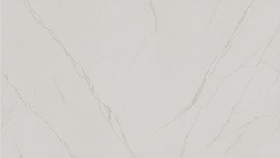 The primary subject of the image is a white marble wall with a pattern of swirls. The setting is a room with a white marble floor. The visual style is a close-up of the marble wall, showcasing its texture and pattern. The colors and mood of the image are predominantly white, giving it a clean and elegant appearance.