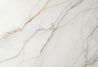 The image features a white marble wall with a gold-colored line running through it. The wall appears to be a part of a bathroom, as it is described as a marble bathroom wall. The gold line adds a touch of elegance and sophistication to the otherwise plain white wall.