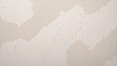 The primary subject of the image is a white wall with a pattern of peeling paint. The setting is a room with a tan background. The visual style is a close-up of the wall, showcasing the peeling paint. The colors and mood of the image are predominantly neutral, with the peeling paint adding a touch of imperfection to the otherwise clean and simple scene.