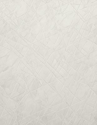 The primary subject of the image is a white marble wall with a pattern of triangles. The setting is a room with a white marble floor. The visual style is a close-up of the marble wall, showcasing its texture and pattern. The colors and mood of the image are predominantly white, giving it a clean and elegant appearance.