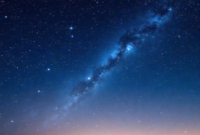 The primary subject of the image is the night sky filled with stars. The setting is a dark, clear night with a few stars visible in the sky. The visual style is a photo of the night sky, capturing the beauty of the stars and the vastness of the universe. The colors and mood of the image are serene and peaceful, as the night sky is illuminated by the stars and the darkness of the night.