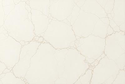 The primary subject of the image is a white marble wall with a textured surface. The setting is a room with a white marble floor. The visual style is a close-up of the marble wall, showcasing its unique texture. The colors and mood of the image are predominantly white, giving it a clean and elegant appearance.