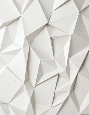 The primary subject of the image is a white wall with a pattern of triangles. The setting is a room with a white background. The visual style is a close-up of the wall, showcasing the intricate pattern of the triangles. The colors and mood of the image are predominantly white, giving it a clean and minimalist appearance.