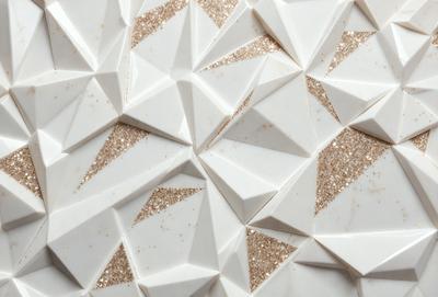 The primary subject of the image is a white and gold patterned wallpaper. The setting is a white wall, and the visual style is a close-up of the wallpaper. The dominant colors are white and gold, creating a luxurious and elegant atmosphere.