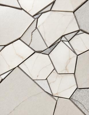 The image features a white marble wall with a unique pattern of hexagonal shapes. The wall appears to be made of tiles, and the hexagons are arranged in a way that creates a visually appealing design. The overall atmosphere of the image is clean and elegant, with the white marble and hexagonal pattern creating a sense of sophistication and refinement.