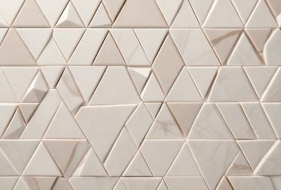 The primary subject of the image is a white marble tile wall with a geometric pattern. The setting is a room with a white marble tile wall, which serves as the background. The visual style is a close-up of the marble tile wall, showcasing the intricate pattern and texture. The dominant colors are white and grey, creating a clean and elegant atmosphere.