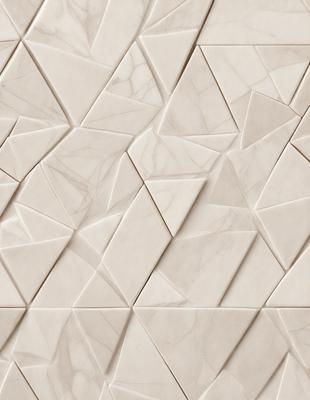 The primary subject of the image is a marble wall with a unique pattern. The setting is a room with a white marble wall, which serves as the background. The visual style is a close-up of the marble wall, showcasing its intricate design. The colors and mood of the image are predominantly white, giving it a clean and elegant appearance.