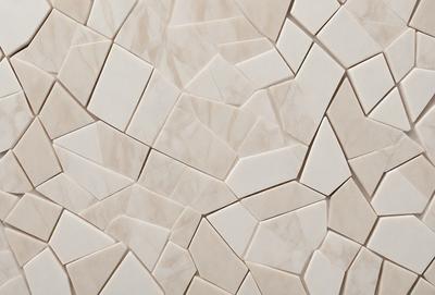 The primary subject of the image is a white marble wall with a pattern of square tiles. The setting is a room with a white marble floor. The visual style is a close-up of the marble wall, showcasing the intricate pattern of the tiles. The colors and mood of the image are predominantly white, giving it a clean and elegant appearance.