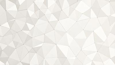 The image features a white wall with a geometric pattern, possibly a triangular or hexagonal design. The wall appears to be made of white tiles or a similar material. The pattern creates a visually interesting and unique appearance.