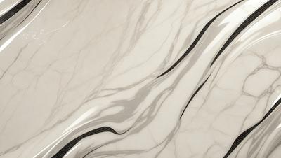 The primary subject of the image is a marble countertop with a silver faucet. The setting is a bathroom, and the visual style is a photo. The countertop is white, and the faucet is silver, creating a clean and elegant appearance. The overall atmosphere is sophisticated and luxurious.