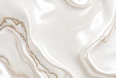 The primary subject of the image is a white marble countertop. The setting is a kitchen, with the countertop being the main focus of the scene. The visual style is a close-up of the marble countertop, showcasing its texture and beauty. The colors and mood of the image are predominantly white, giving it a clean and elegant appearance.