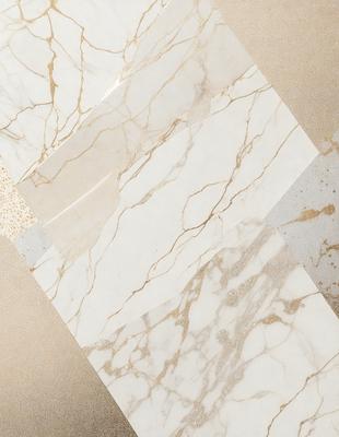 The primary subject of the image is a marble tile, which is the main object, scene, or focus of the image. The setting is a wall, and the visual style is a photo. The dominant colors are white and gold, creating a clean and elegant atmosphere.