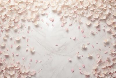 The primary subject of the image is a white marble countertop with a beautiful arrangement of pink flowers. The flowers are scattered across the countertop, creating a visually appealing and elegant display. The setting is a kitchen or a similar indoor space, as the countertop is a common area for food preparation and serving. The visual style of the image is a combination of photo and digital art, as the flowers are realistically depicted while the countertop appears to be a digital creation. The colors and mood of the