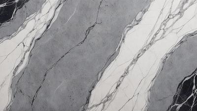 The primary subject of the image is a marble wall with a patterned design. The setting is a room with a white background. The visual style is a close-up of the marble wall, showcasing its intricate pattern. The colors and mood of the image are predominantly white and gray, giving it a clean and elegant appearance.