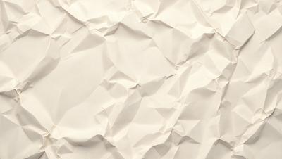 The primary subject of the image is a white paper with a wrinkled texture. The setting is a white background, and the visual style is a close-up of the paper. The colors and mood of the image are predominantly white, giving it a clean and minimalist appearance.