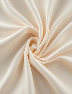 The primary subject of the image is a close-up of a white sheet of fabric. The setting is a white background, which provides a clean and minimalistic appearance. The visual style is a photo, capturing the details of the fabric. The colors and mood of the image are predominantly white, giving it a clean and serene atmosphere.
