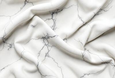 The primary subject of the image is a white marble surface. The setting is a white marble countertop, and the visual style is a photo. The colors and mood of the image are predominantly white, giving it a clean and elegant appearance.