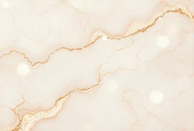 The primary subject of the image is a marble countertop with a gold-colored streak running through it. The setting is a kitchen, and the visual style is a close-up of the marble countertop. The colors and mood of the image are predominantly neutral, with the gold streak adding a touch of warmth and sophistication to the overall atmosphere.