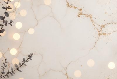 The primary subject of the image is a marble countertop with a gold-colored pattern. The setting is a bathroom, and the visual style is a photo. The countertop has a white background with gold dots, giving it a luxurious and elegant appearance. The colors and mood of the image are predominantly white and gold, creating a sense of sophistication and refinement.