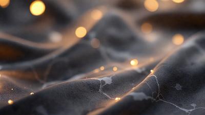 The primary subject of the image is a close-up of a black cloth with a pattern of yellow lights. The setting is a dark background, and the visual style appears to be a photo. The dominant colors are black and yellow, creating a moody and intriguing atmosphere.