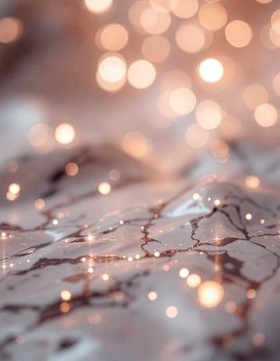 The primary subject of the image is a close-up of a marble surface with a pattern of bright lights on it. The setting is a room with a white background, and the visual style appears to be a combination of a photo and digital art. The colors and mood of the image are predominantly warm and inviting, with the bright lights creating a sense of depth and texture on the marble surface.