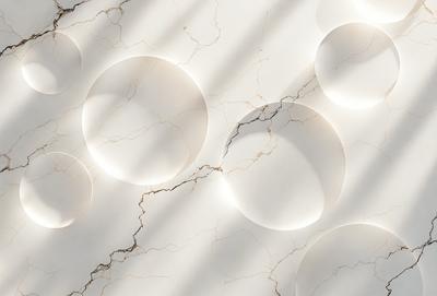 The primary subject of the image is a white marble wall with a pattern of white balls on it. The setting is a room with a white marble floor. The visual style is a photo of the marble wall and floor. The dominant colors are white, and the overall atmosphere is clean and elegant.